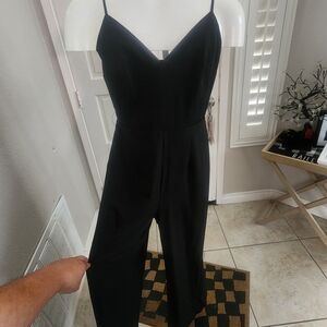 Yumi Kim Classic Black Jumpsuit
Sleek with flattering V-neck and pockets XS